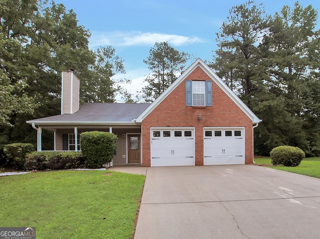 view of front of house featuring a garage and a front lawn