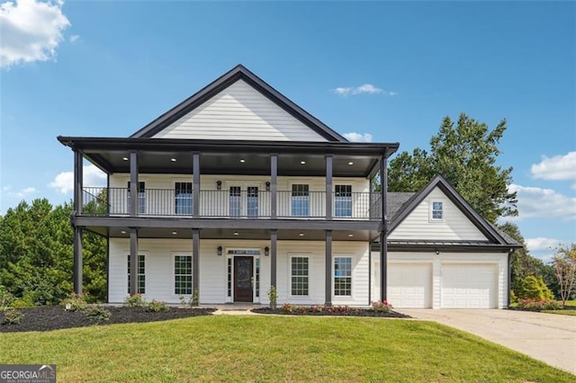 view of front of house with a balcony, a front yard, and a garage