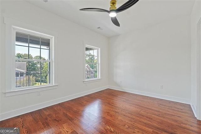 unfurnished room featuring ceiling fan and hardwood / wood-style flooring