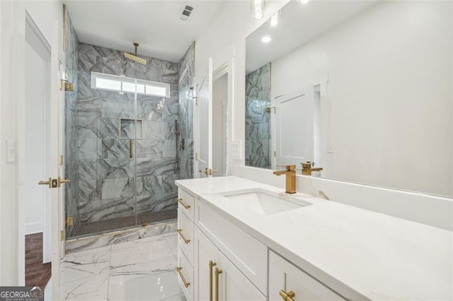 bathroom featuring hardwood / wood-style flooring, vanity, and walk in shower