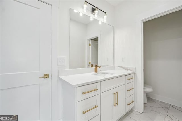 bathroom with tile patterned flooring, toilet, and vanity