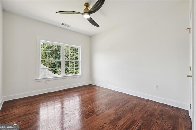 empty room featuring ceiling fan and hardwood / wood-style floors