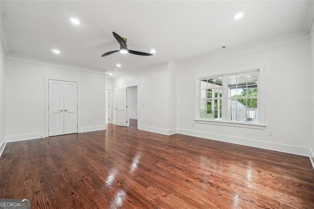 unfurnished bedroom featuring ceiling fan, ornamental molding, and wood-type flooring