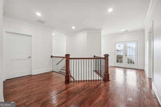 hallway featuring hardwood / wood-style floors and ornamental molding