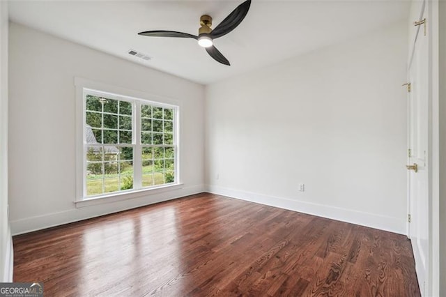 empty room with ceiling fan and hardwood / wood-style flooring