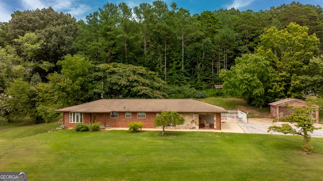 view of front of property with a patio and a front yard