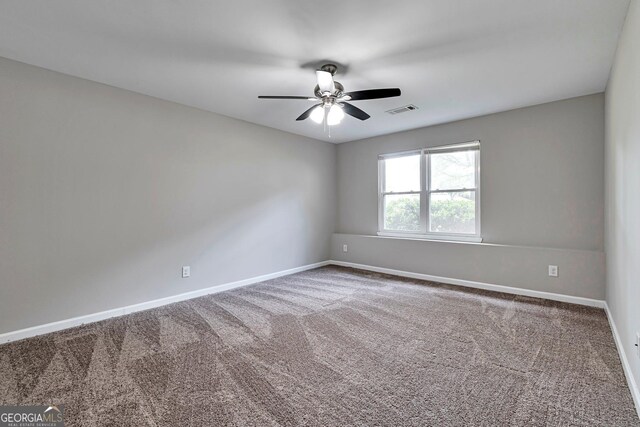 unfurnished room with carpet floors and ceiling fan