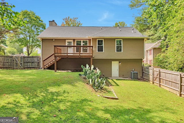 back of house featuring a wooden deck, central air condition unit, and a lawn