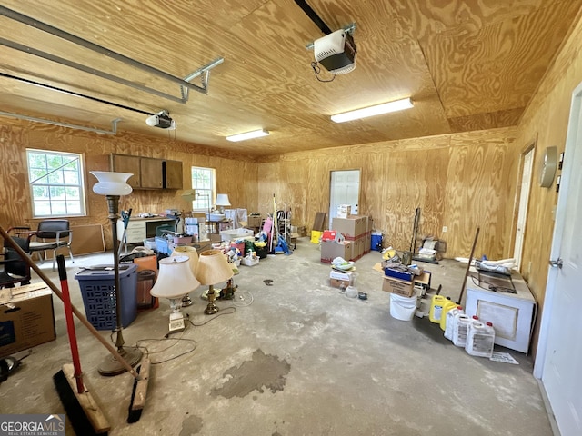 garage featuring wooden ceiling and a garage door opener