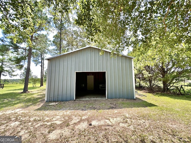 view of pole building with a yard