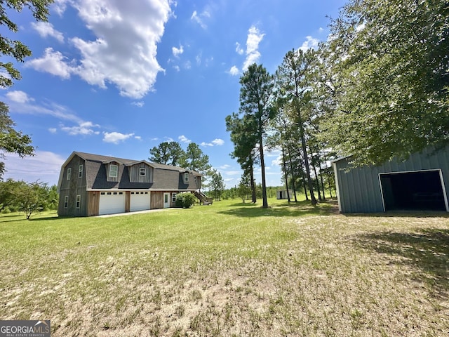 view of yard featuring a garage