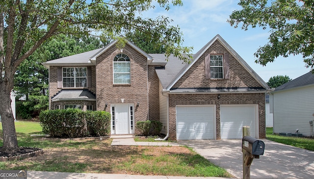 view of front of property with a garage