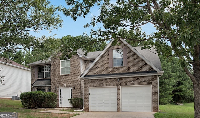 view of front of home featuring brick siding, a shingled roof, a garage, cooling unit, and driveway