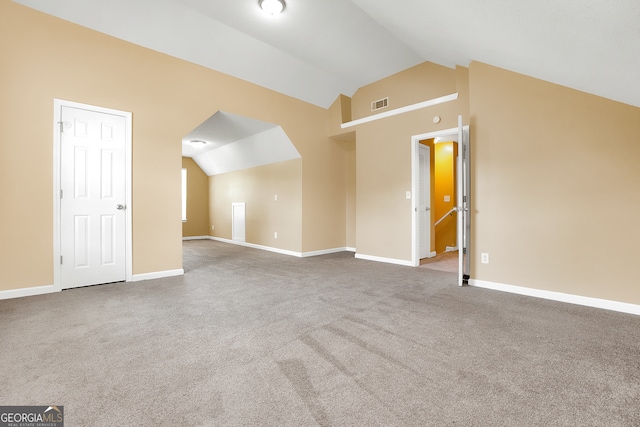 bonus room with carpet flooring and lofted ceiling