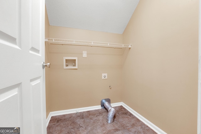 washroom featuring washer hookup, electric dryer hookup, a textured ceiling, laundry area, and baseboards