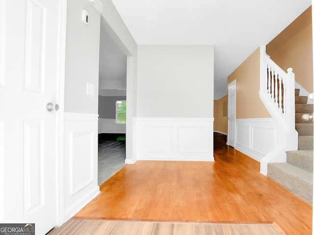 interior space with light wood-style floors and stairway