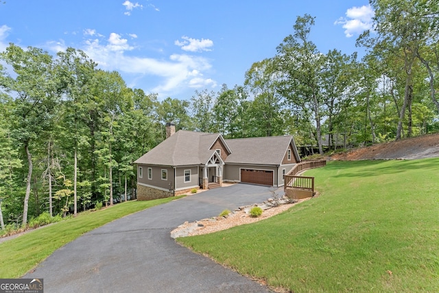 view of front of house with a front lawn and a garage