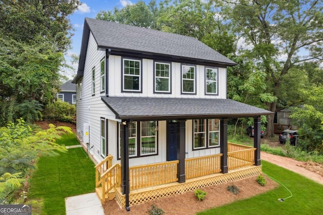 view of front of property with a front lawn and a porch