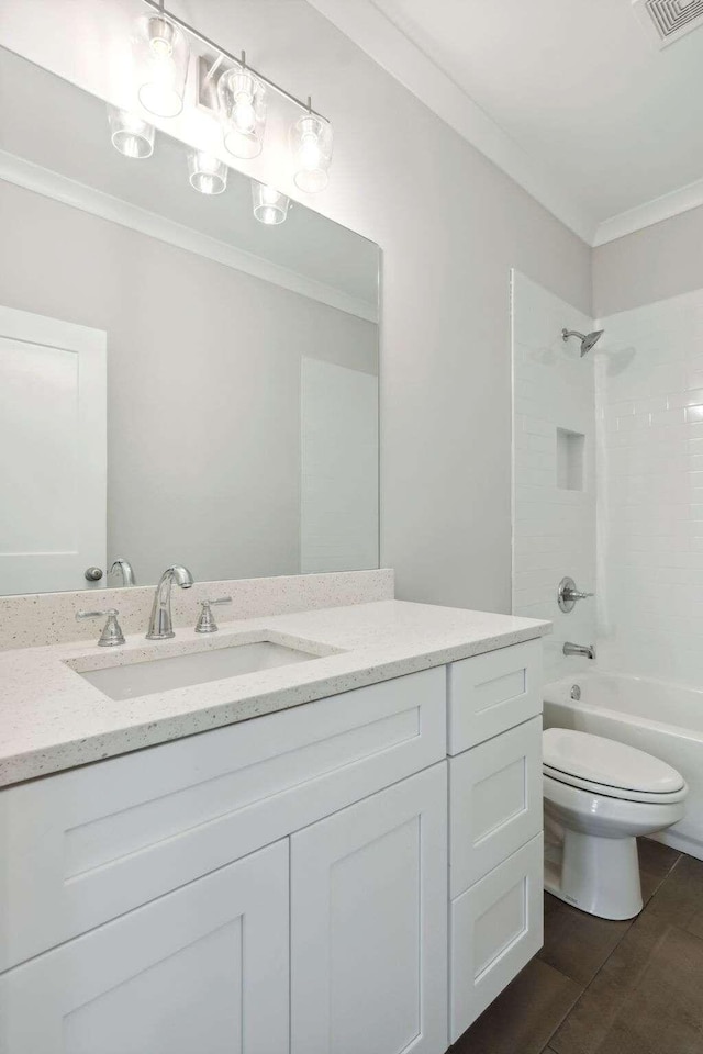 full bathroom with tile patterned floors, shower / bathtub combination, vanity, crown molding, and toilet