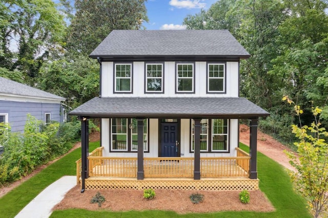 view of front of house featuring a front yard and a porch