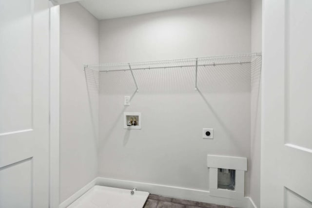 clothes washing area featuring hookup for a gas dryer, hookup for a washing machine, and hookup for an electric dryer