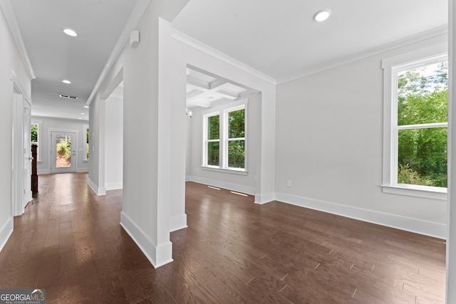 hall with crown molding, dark wood-type flooring, a healthy amount of sunlight, and coffered ceiling