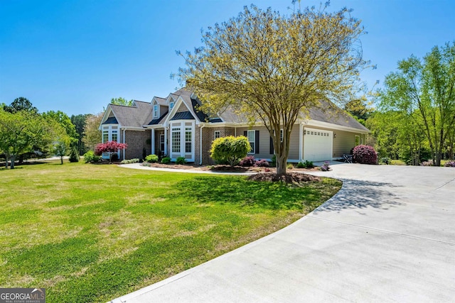 view of front of home with a front lawn and a garage