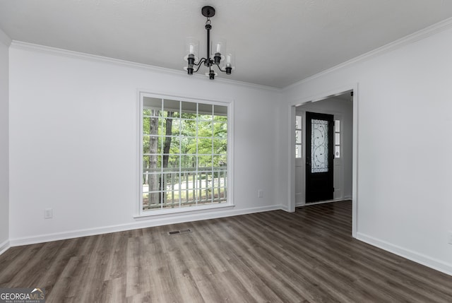 unfurnished dining area with crown molding, a chandelier, and dark hardwood / wood-style floors