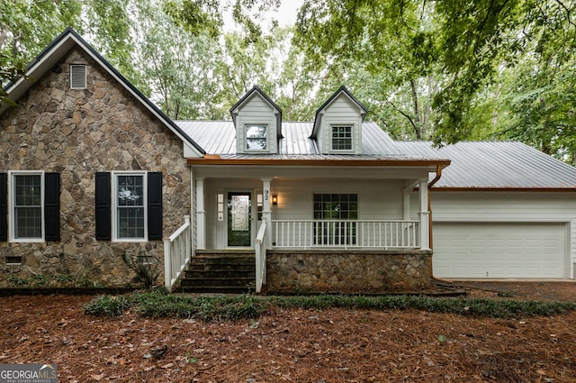 view of front of home featuring covered porch and a garage