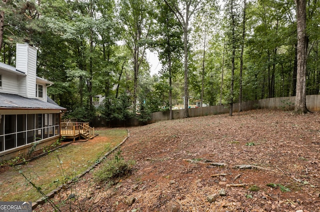 view of yard featuring a wooden deck