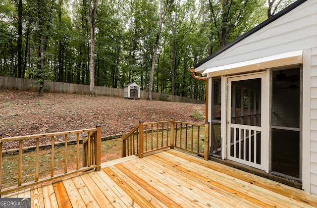 wooden terrace with a shed