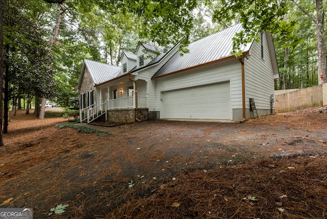 view of front facade featuring a garage and covered porch