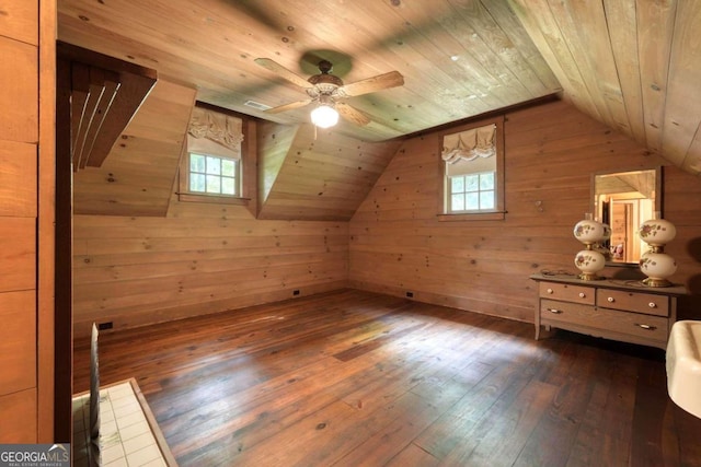 bonus room with wooden ceiling, dark hardwood / wood-style floors, wooden walls, ceiling fan, and lofted ceiling