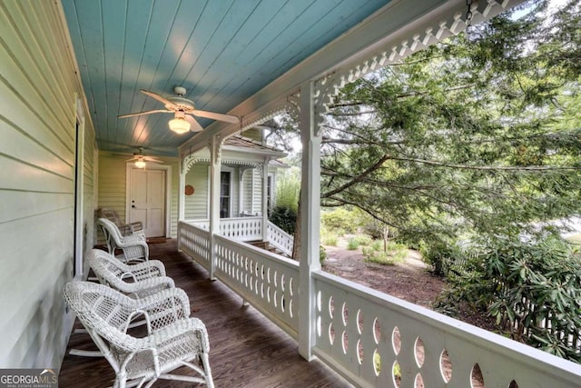 balcony featuring ceiling fan and a porch