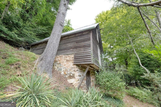 exterior space with stone siding