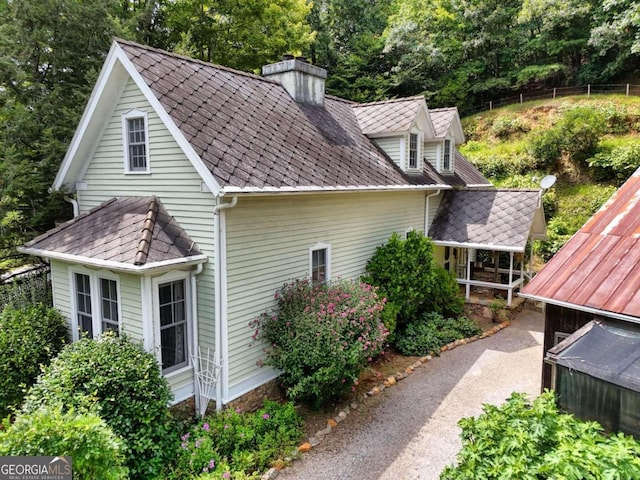 view of side of property with a chimney