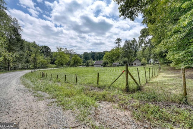 view of road featuring a view of trees and a rural view