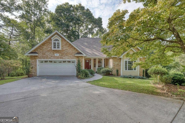 view of front of property featuring a front lawn and a garage