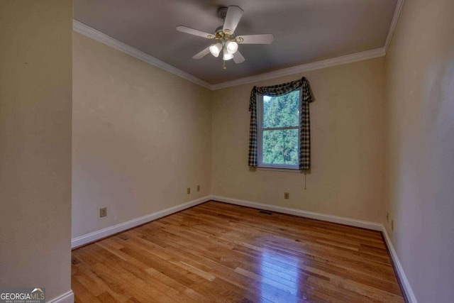 spare room with ceiling fan, light hardwood / wood-style floors, and ornamental molding