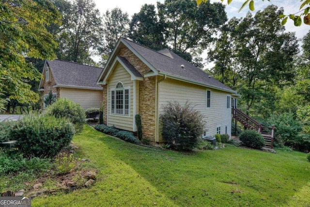 view of home's exterior with a yard