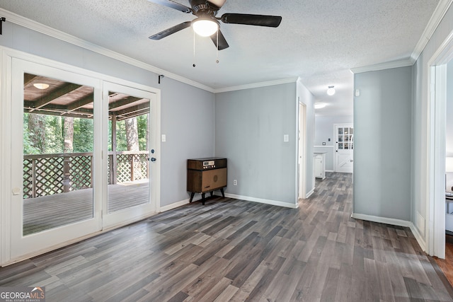 empty room featuring ceiling fan, a textured ceiling, crown molding, and hardwood / wood-style floors