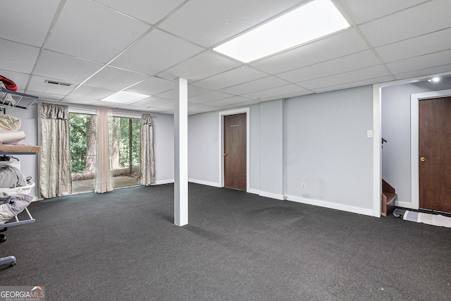 basement with carpet floors and a drop ceiling