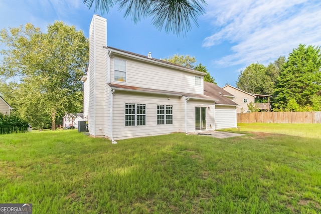 back of property with a lawn, cooling unit, and a patio