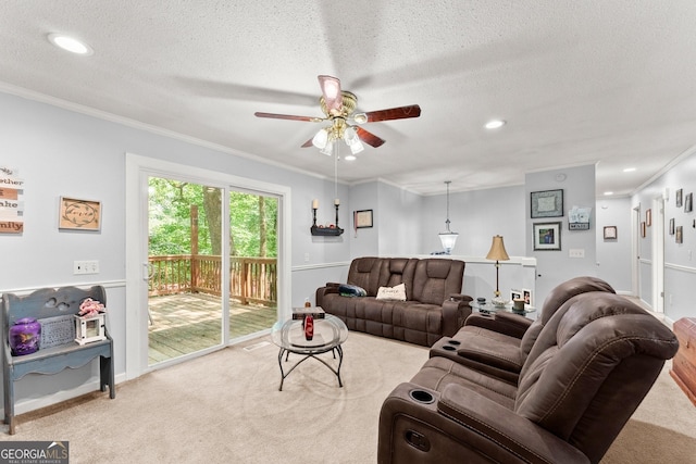 living area featuring a textured ceiling, carpet flooring, recessed lighting, and ornamental molding