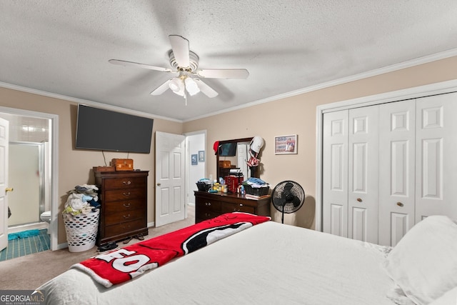 carpeted bedroom featuring a textured ceiling, a ceiling fan, a closet, and ornamental molding