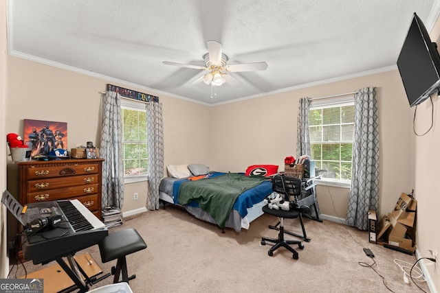 bedroom with ornamental molding, a textured ceiling, carpet, baseboards, and ceiling fan