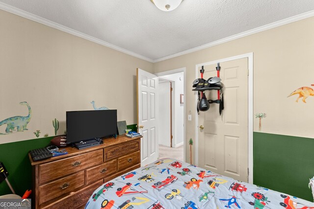 carpeted bedroom featuring a textured ceiling and ornamental molding