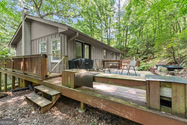 wooden terrace featuring grilling area