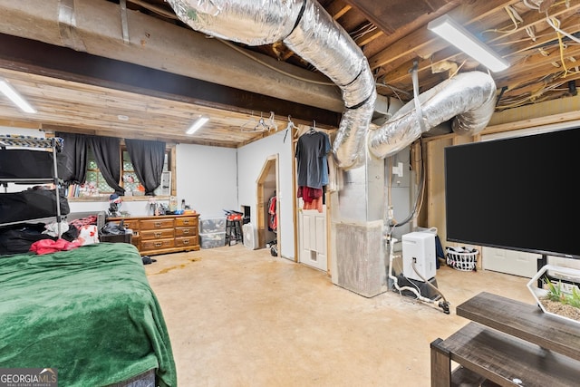 interior space with heating unit and unfinished concrete floors