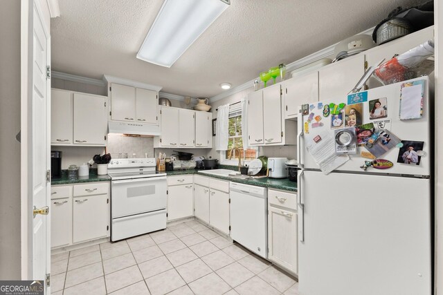 kitchen featuring sink, a textured ceiling, crown molding, light tile patterned flooring, and white appliances